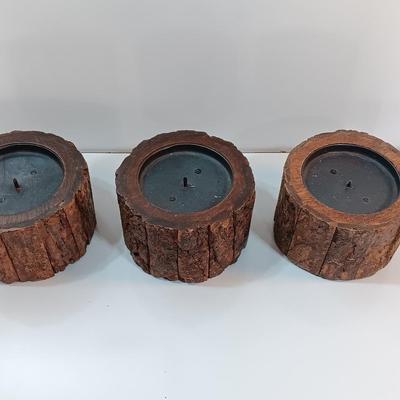 Three rustic wooden pillar candle holders