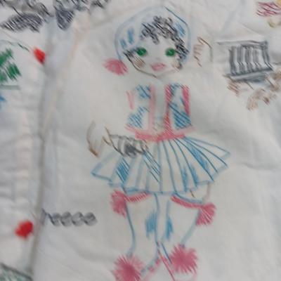 Antique Child's quilt hand stitched with people from different countries all over it
