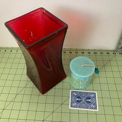 Red Glass Vase and Decorative Candle