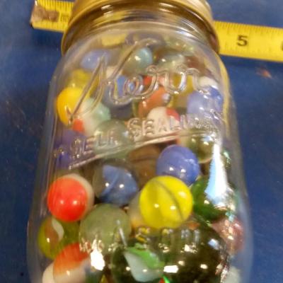 LOT 196 OLD JAR WITH MARBLES