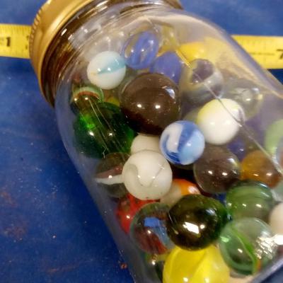 LOT 196 OLD JAR WITH MARBLES