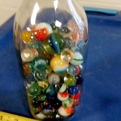 LOT 198 OLD MILK BOTTLE FILLED WITH MARBLES