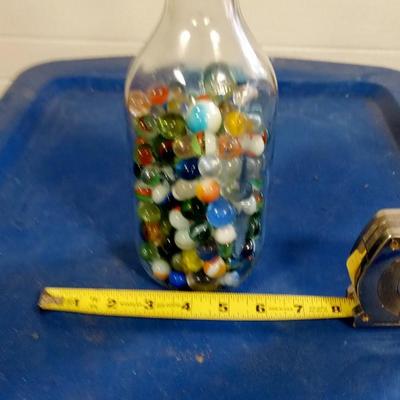 LOT 198 OLD MILK BOTTLE FILLED WITH MARBLES
