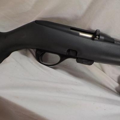 Remington model 597 , 22 LR. rifle w/ 6 shot magazine.est $125 to $220.
