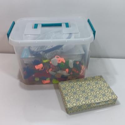 Multi Color Embroidery Floss / thread with crafting projects in a small plastic tote