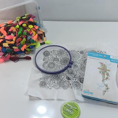 Multi Color Embroidery Floss / thread with crafting projects in a small plastic tote