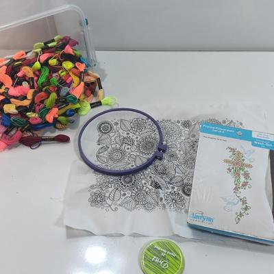 Multi Color Embroidery Floss / thread with crafting projects in a small plastic tote