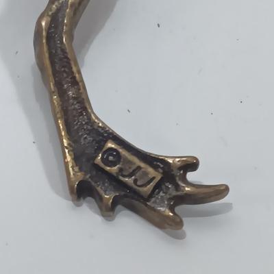 Brass frog with climbing brass frog brooch
