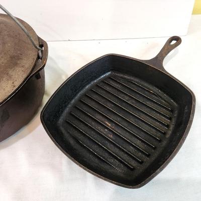 Lot #132  Two Cast Iron pieces - Dutch over with lid and Griddle