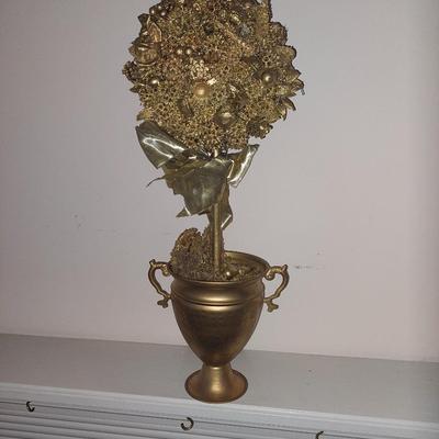 Gold leaf acorn statue