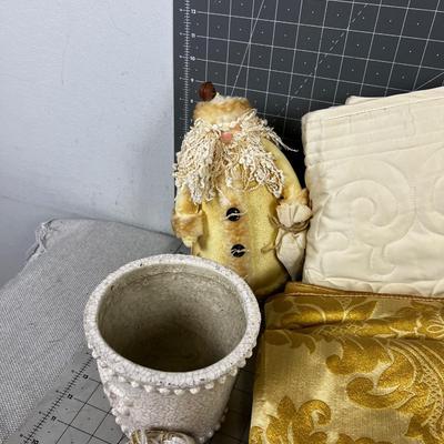 Decorative Items: Candles, Vase, Linens