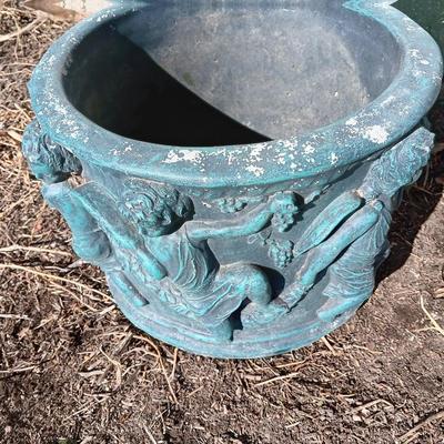 Cement flowerpot with cherubs and a angel garden art piece