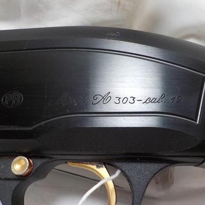 Beretta Angle port Class A-303  shot gun, 12 gauge 3in, est. $300 to $1200.