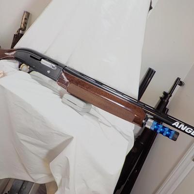 Beretta Angle port Class A-303  shot gun, 12 gauge 3in, est. $300 to $1200.