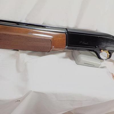 Beretta Angle port Class A-303  shot gun, 12 gauge 3in, est. $300 to $1200.