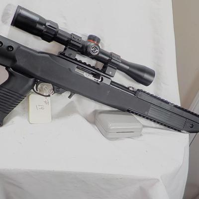Ruger  model 10/22- 22 LR semi auto w/ scope 10 shot mag. est. $200 to $450.
