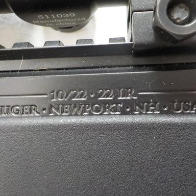 Ruger  model 10/22- 22 LR semi auto w/ scope 10 shot mag. est. $200 to $450.
