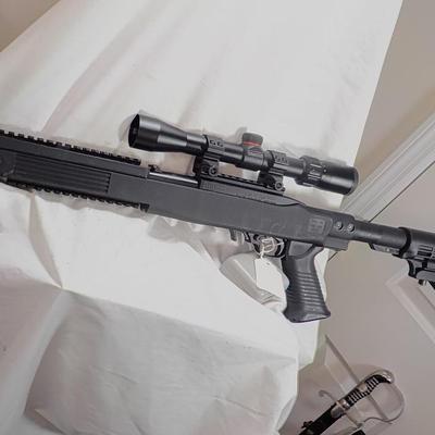 Ruger  model 10/22- 22 LR semi auto w/ scope 10 shot mag. est. $200 to $450.