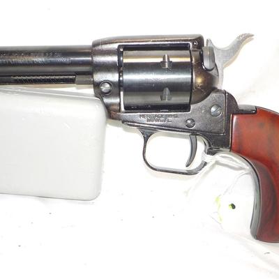 Rough Rider Heritage 22 cal . single action w/ manuel ejector. est. $125 to $200.