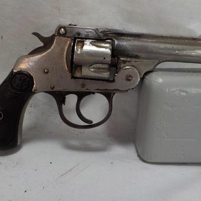 Iver Johnson flip back, double action 32 cal revolver. est $75 to $125.