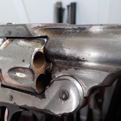 Iver Johnson flip back, double action 32 cal revolver. est $75 to $125.