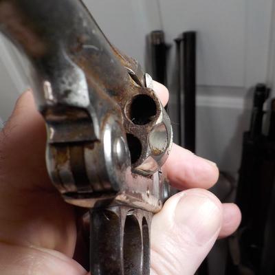 Iver Johnson flip back, double action 32 cal revolver. est $75 to $125.