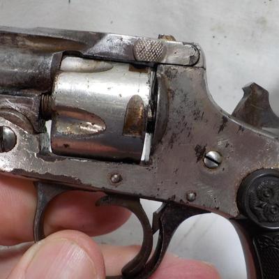 Iver Johnson flip back, double action 32 cal revolver. est $75 to $125.