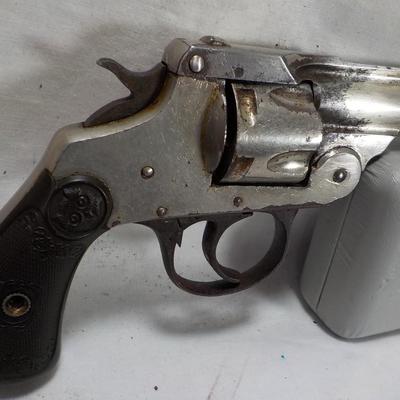 Iver Johnson flip back, double action 32 cal revolver. est $75 to $125.