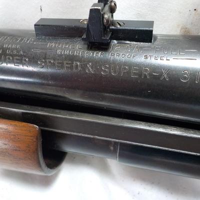 Winchester Model 12 Ga. Pump w/ 32 in. Barrel shot gun. est. $300 to $500.