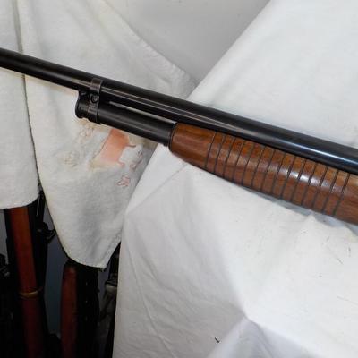 Winchester Model 12 Ga. Pump w/ 32 in. Barrel shot gun. est. $300 to $500.