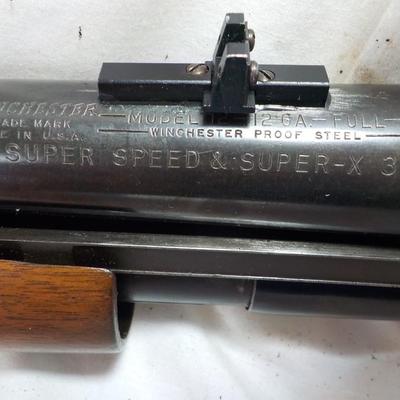 Winchester Model 12 Ga. Pump w/ 32 in. Barrel shot gun. est. $300 to $500.