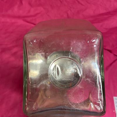 Tilted apothecary glass jar
