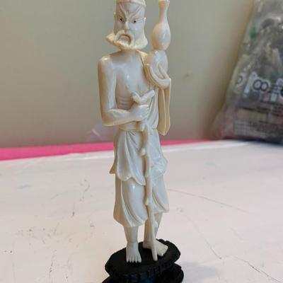 Carved Asian Figure about 6.5 inches tall