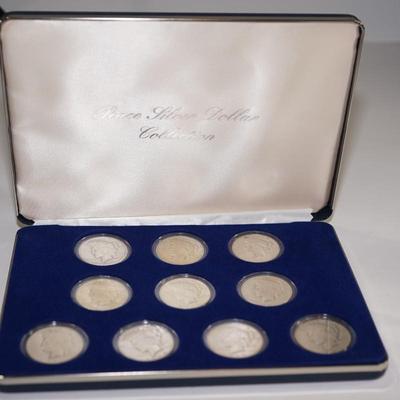PEACE SILVER DOLLAR COLLECTION 1920'S /30'S  -TEN IN A PRESENTATION BOX & PLASTIC CASES.