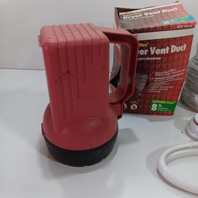 Dryer vent pipes and a flashlight