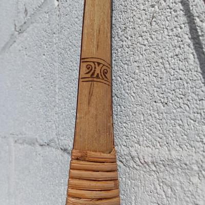 Hand carved two faced Native American head archery decorative bow with arrows.