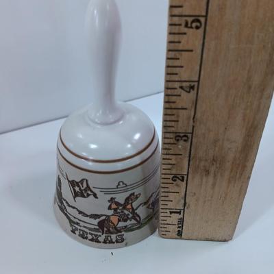 Picture frames and a ceramic Texas bell