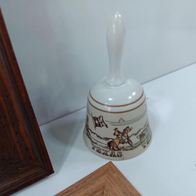 Picture frames and a ceramic Texas bell