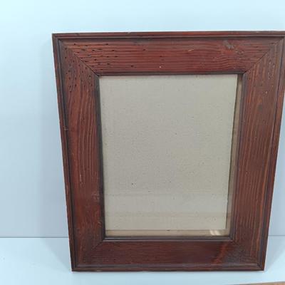 Picture frames and a ceramic Texas bell