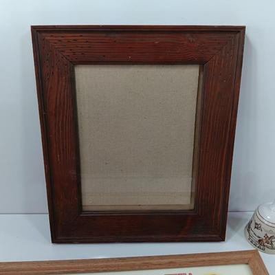 Picture frames and a ceramic Texas bell