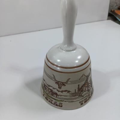 Picture frames and a ceramic Texas bell