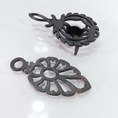 Two cast Oron trivets - Candle holder and Iron trivet