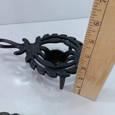 Two cast Oron trivets - Candle holder and Iron trivet