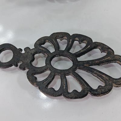 Two cast Oron trivets - Candle holder and Iron trivet