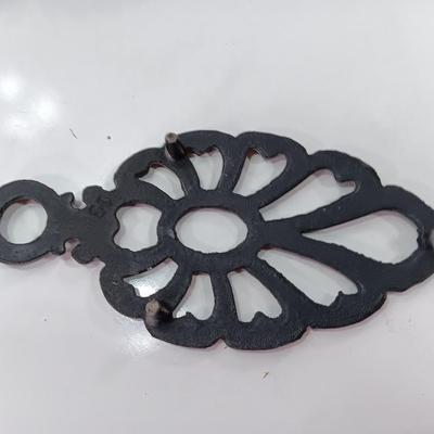 Two cast Oron trivets - Candle holder and Iron trivet