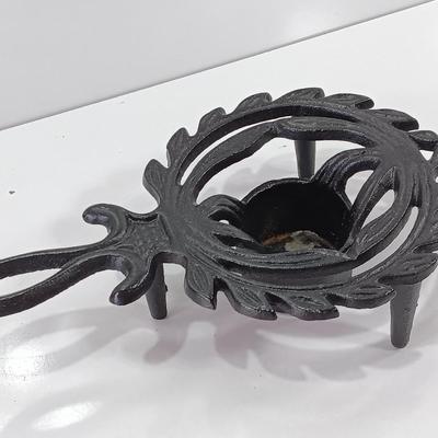 Two cast Oron trivets - Candle holder and Iron trivet