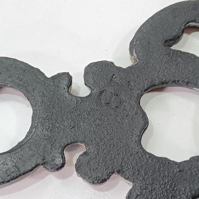 Two cast Oron trivets - Candle holder and Iron trivet