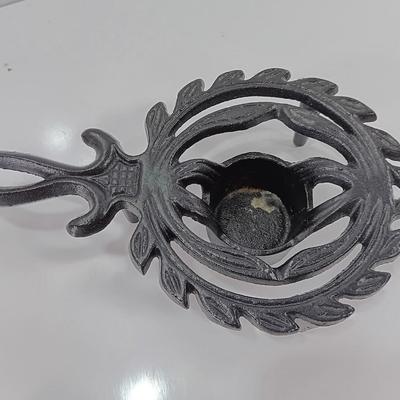 Two cast Oron trivets - Candle holder and Iron trivet