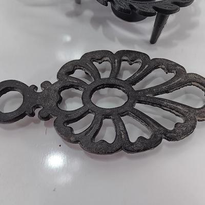 Two cast Oron trivets - Candle holder and Iron trivet