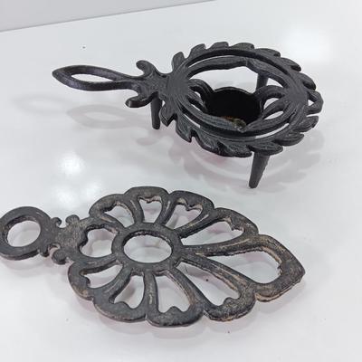 Two cast Oron trivets - Candle holder and Iron trivet